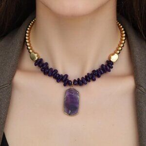 Focus on Purple. Purple rotate beads finished in gold with Purple pendant